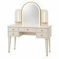 Tocador de madera y metal con espejo arqueado, blanco y dorado